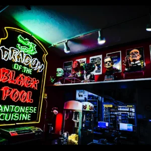 Dragon of the Black Pool neon glowing green inside Movie Madness — Noir10 handmade backlit print