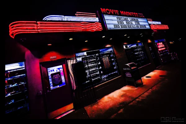 Movie Madness neon sign glowing red at night — Noir10 handmade LED backlit print