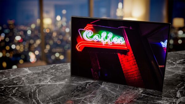 Stumptown Coffee neon sign glowing red at night living room — Noir10 handmade LED backlit print