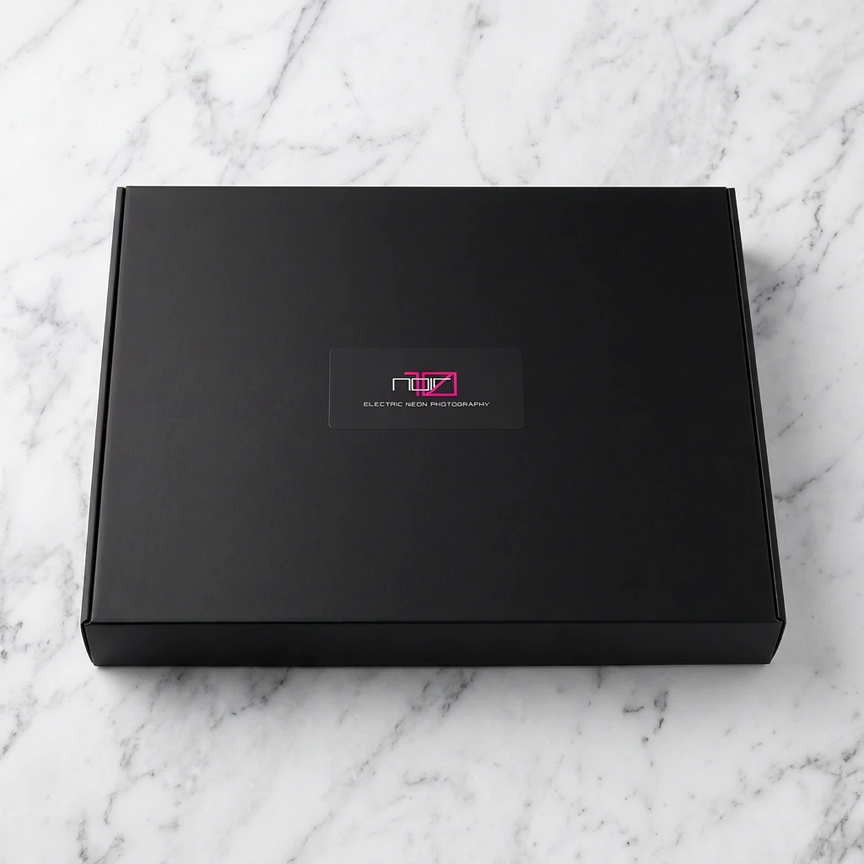 Noir10 Package design - black box unopened with logo