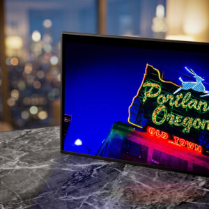 White Stag Portland, Oregon neon sign glowing gold at dusk — Noir10 handmade LED backlit print