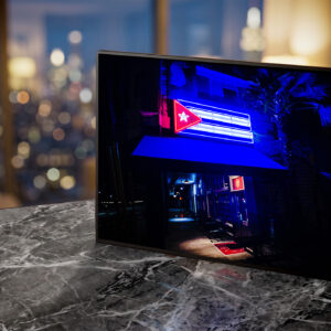 Pambiche neon sign glowing blue at night — Noir10 handmade LED backlit print