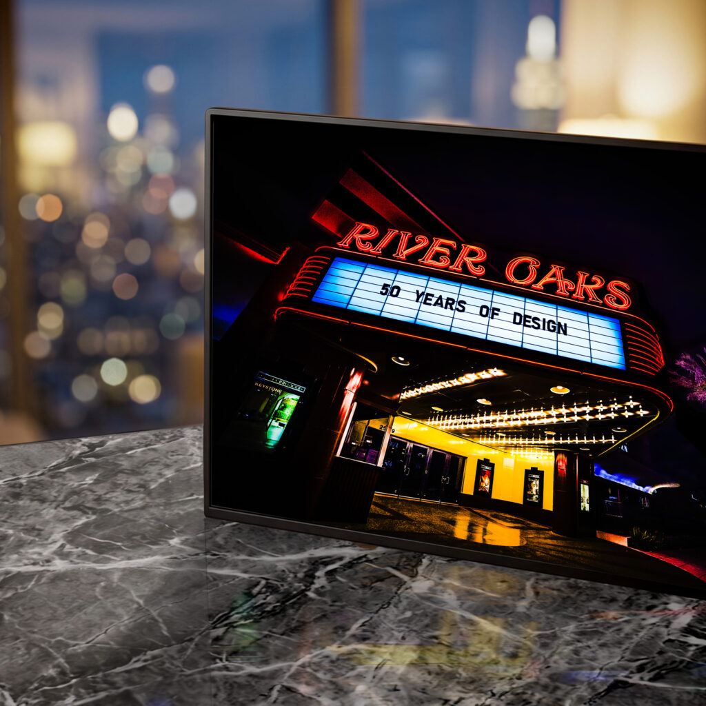River Oaks theater neon marquee glowing red and yellow at night — Noir10 handmade LED backlit print