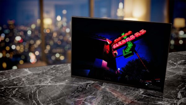 Tip Top neon sign glowing red and green at dusk — Noir10 handmade LED backlit print